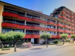 a large apartment building with trees in front of it at OCEAN PLAGE Appartement-terrasse-garage-wifi-draps et serviettes in Hendaye