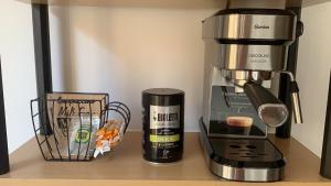 a coffee maker sitting on top of a counter at OCEAN PLAGE Appartement-terrasse-garage-wifi-draps et serviettes in Hendaye