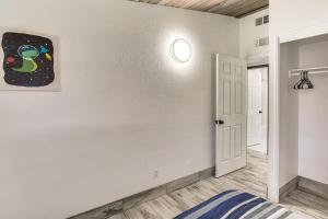 a room with a bed and a painting on the wall at 1 Mi to Main St Eats! Single-Level Red Bluff Home in Red Bluff +18 photos