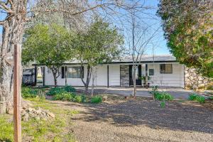 a white house with trees in front of it at 1 Mi to Main St Eats! Single-Level Red Bluff Home in Red Bluff