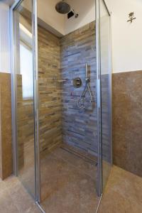 a shower with a glass door in a bathroom at Chalet Boscopiano in Valdidentro +63 photos