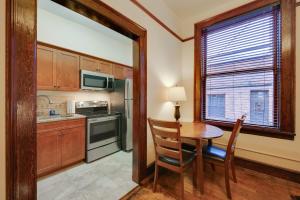 a kitchen with a table and chairs and a window at Epic Silver Valley Basecamp: Steps to Dtwn Fun! in Wallace