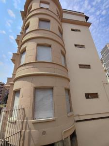 a tall building with a tower on top of it at Casa Dante 4 in Pavia +1 photo
