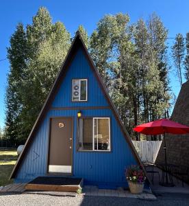 a blue house with a pointed roof at Aspen Inn in Fort Klamath