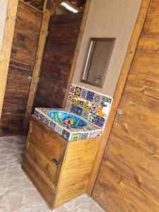 a small bathroom with a toilet in a room at Eco ITZKA Bernal Country House in Bernal