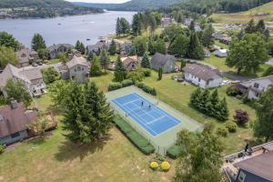 an aerial view of a house with a tennis court at Lake & Lift by Railey Vacations in McHenry