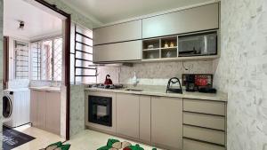 a kitchen with a sink and a counter top at 3D apartment, central - prox UFN in Santa Maria