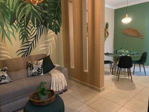 a living room with a couch and a table at Casa Familiar en La Paz BCS in La Paz