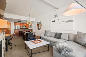 a living room with a couch and a table at The Powder Post Capitol Peak Lodge #3225 in Snowmass Village