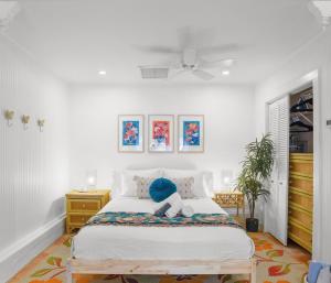 a bedroom with a bed with a blue stuffed animal on it at Be A Nomad - Pool Access Studio Apartment - Jacksonville Beach Couples in Jacksonville Beach