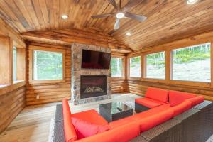 a living room with a couch and a fireplace at Lakefront Escape by Railey Vacations in Swanton +36 photos