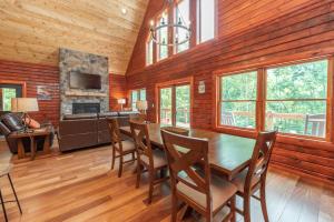 a dining room with a table and chairs at Lakefront Escape by Railey Vacations in Swanton