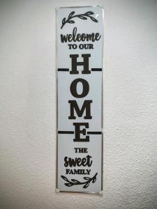 a sign on a wall that reads welcome to our team the sweet family at Hogar, Home, Accueil, Casa, Zuhause in Alicante