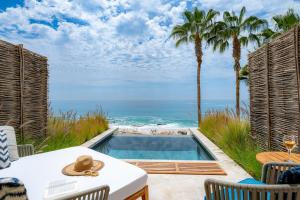 a view of the ocean from a patio with a swimming pool at Hilton Los Cabos in San José del Cabo