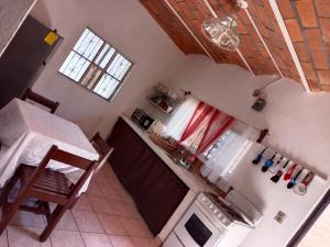 an overhead view of a kitchen with a table and a stove at Casa Amelia in San Blas