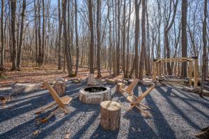 a fire pit in the middle of a forest at Casa Olive by Railey Vacations in Accident