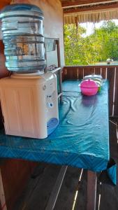 a table with a blender on top of it at Adefiro Homestay in Besir