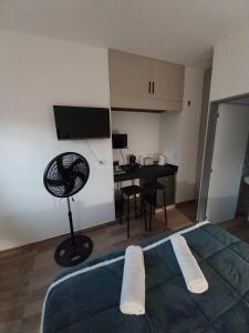 a living room with a room with a table and a room at Dormi km3 in Comodoro Rivadavia
