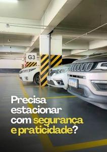 a parking garage with two cars parked in it at Smart Hotel Joinville in Joinville +18 photos