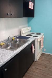 a kitchen with a sink and a stove at GpL 424 San Bernardino in North Fort Myers