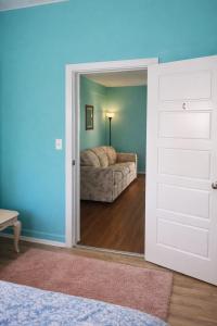 a door leading into a living room with a couch at GpL 424 San Bernardino in North Fort Myers