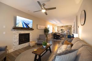 a living room with a couch and a fireplace at Sunflower Beach Cottage in Ocean Shores