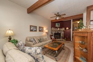 a living room with a couch and a fireplace at Ski Harbor #21 by Railey Vacations in McHenry +24 photos