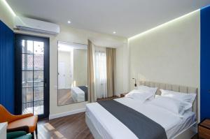 a bedroom with a large bed and a window at 31Mesrop Mashtots Avenu in Yerevan