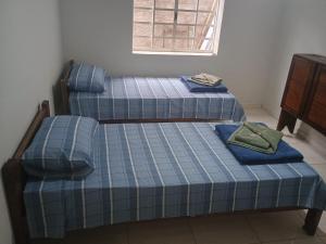 Llit o llits en una habitació de Microcasa pratica