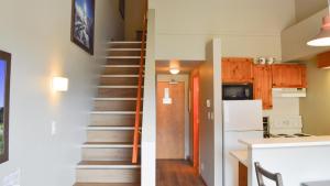 a kitchen and a stairway in a house at Cahilty #454 home in Sun Peaks +5 photos