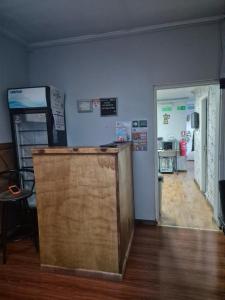 a room with a room with a door and a room with a room at Alojamiento Emilia House y camping in Punta Arenas
