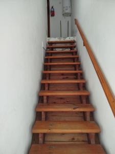 a set of wooden stairs in a room at Tu Destino in San José +1 photo