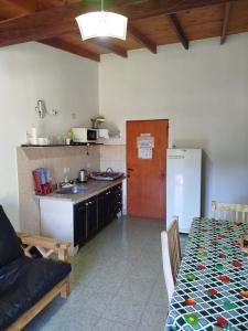 a kitchen with a couch and a table in a room at Tu Destino in San José