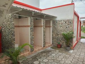 a stone building with plants in front of it at Suite Crucita in Crucita