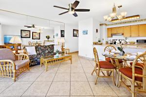 a living room with a couch and a table at Paki Maui 326 in Kahana