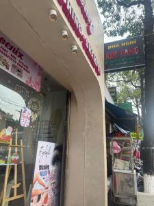 a store with a sign in the window of a store at Nhà nghỉ KIM VÀNG in Phú Quốc