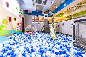 a gym with a large pile of balls at Hotel Pasela Living Shinjuku in Tokyo +58 photos
