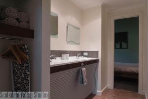 a bathroom with a sink and a mirror at Scotsdale Valley Studios in Harewood +16 photos