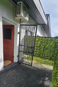 a door to a house with a fan on it at Kula Nest in Suva