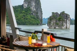 a table on the deck of a boat in the water at Top Hill Halong Homestay in Ha Long