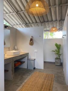 a bathroom with a sink and a mirror at Elephant View Camp in Ban Huai Thawai +33 photos