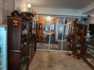 a room with a room with a glass door at Anodash Homestay in Ban Tai
