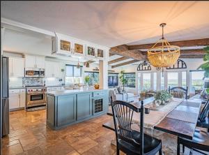 a kitchen and dining room with a table and chairs at Panoramic view in San Marcos