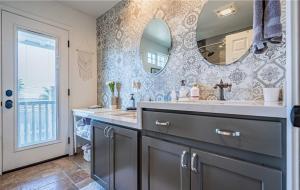 a bathroom with two sinks and a mirror at Panoramic view in San Marcos +16 photos