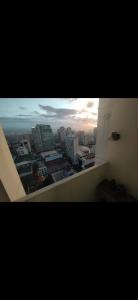 a view of a city skyline from a window at Essel s Comfy Place in Manila
