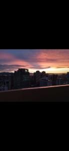 a view of a city skyline at sunset at Essel s Comfy Place in Manila