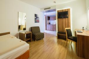Postel nebo postele na pokoji v ubytování Hotel Meridian ***superior