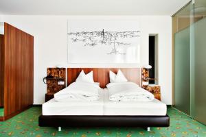 Posteľ alebo postele v izbe v ubytovaní Casinohotel Velden
