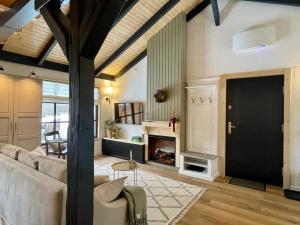 a living room with a couch and a fireplace at Country Charm in Râşnov