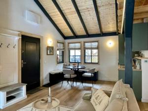 a living room with a couch and a table at Country Charm in Râşnov